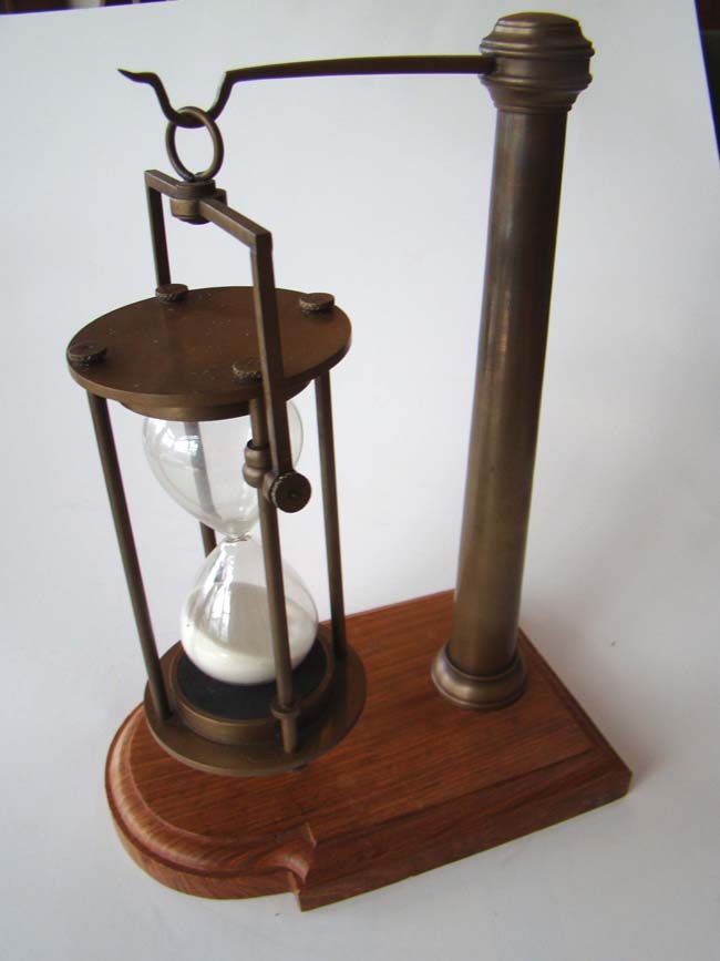 A 20th century hanging hour glass on stand